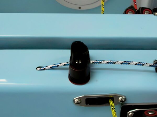 Pole down system using a cam cleat on centrecase