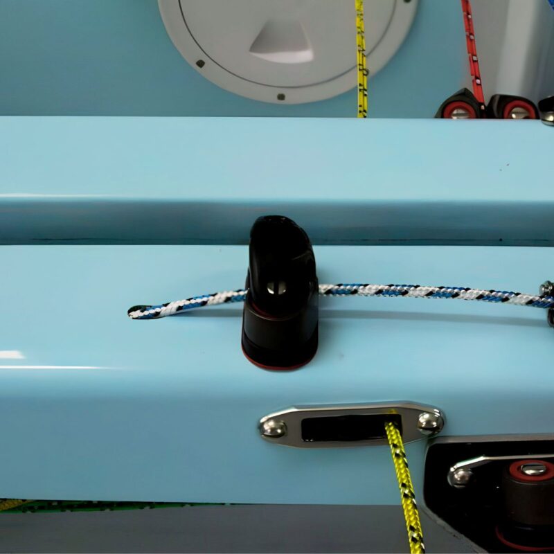 Pole down system using a cam cleat on centrecase